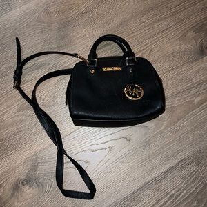 Michael Kors Crossbody or Shoulder bag. Good condition. Black and gold.